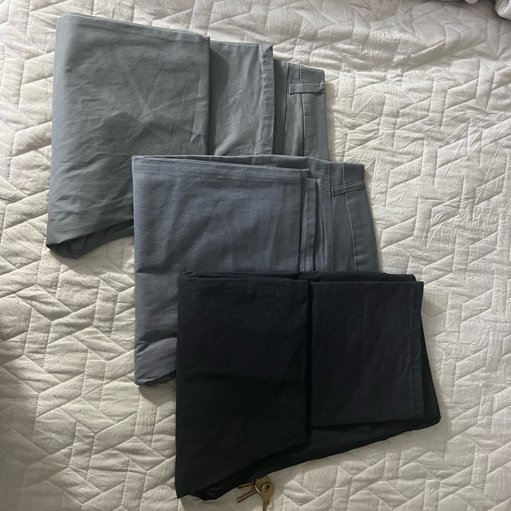 3 pairs of Kennith Cole chinos.